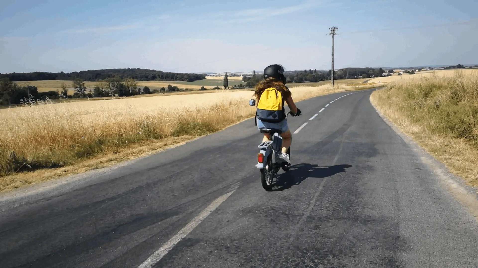 Vintage mopeds on a country road among the vineyards of the Touraine