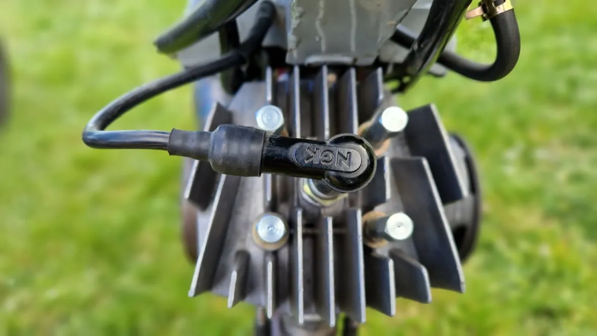 Close-up of a vintage moped engine maintained by ToursNmob